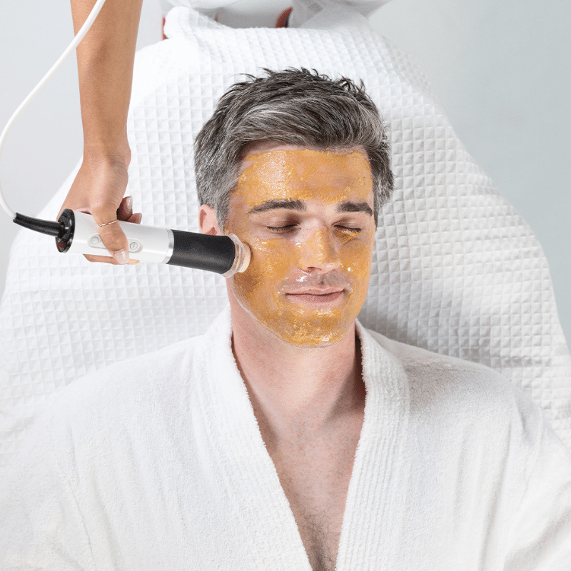 Man receiving Geneo Glam facial treatment