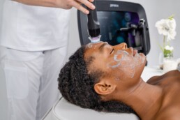 Woman with sensitive skin receiving Geneo facial treatment