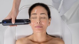 Woman receiving non-surgical facial cosmetic procedure