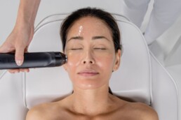 Woman receiving non-surgical facial cosmetic procedure
